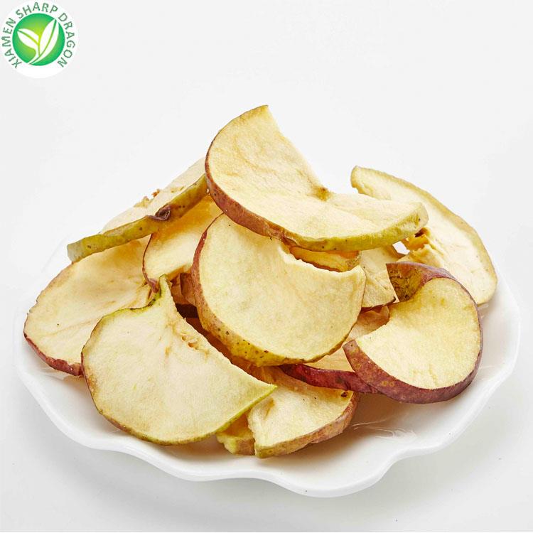 Skin-on apple chips arranged on a white plate